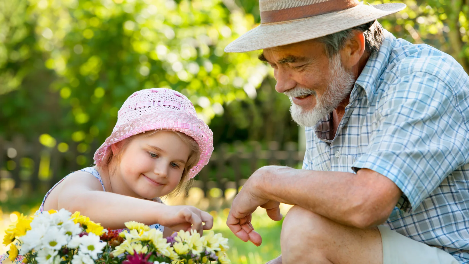 Grandpa gardening with grandkid