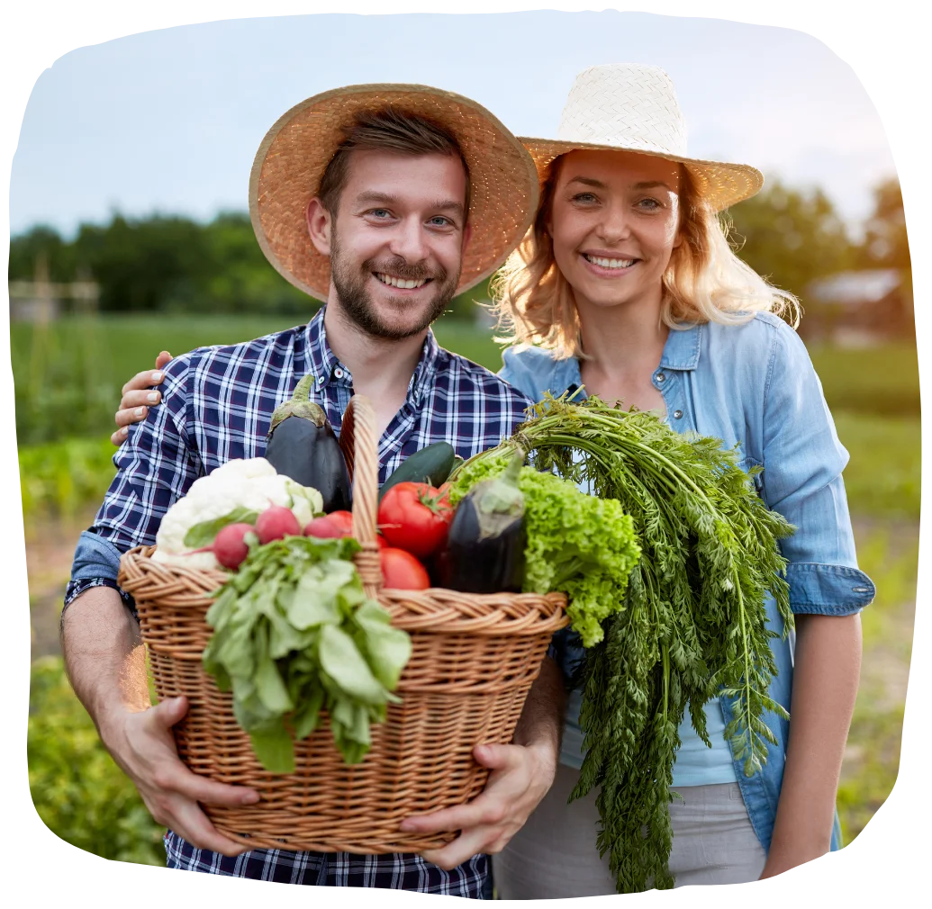 SGS25_Farmers_Shape two farmers holding freshly picked produce